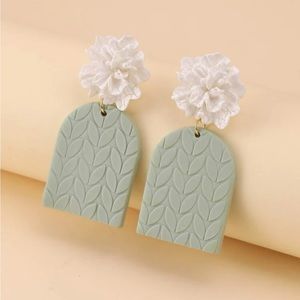 White and teal textured leaf earrings